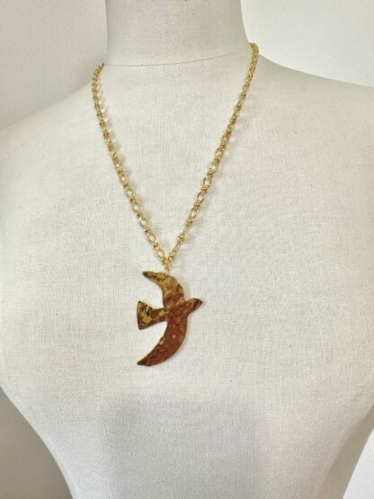 Collier doré oiseau